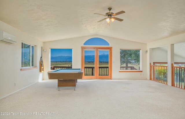 rec room with billiards, lofted ceiling, carpet floors, ceiling fan, and an AC wall unit