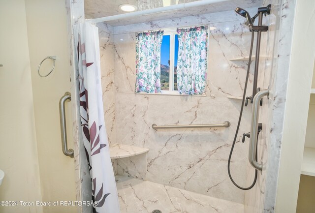 bathroom featuring curtained shower