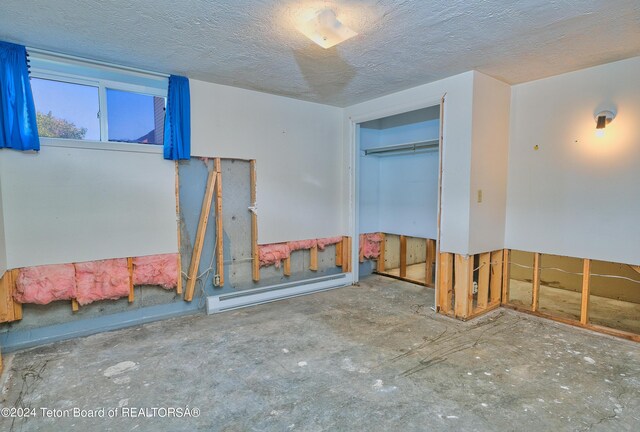 spare room featuring baseboard heating