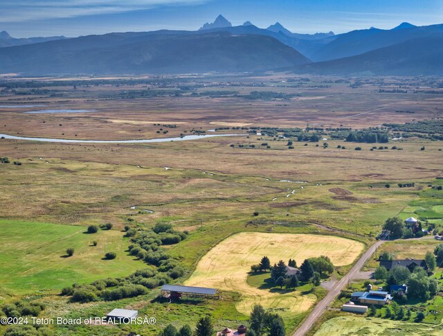 aerial view with a mountain view and a rural view