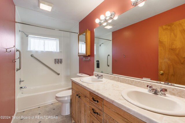 full bathroom featuring dual vanity, shower / bathing tub combination, toilet, and tile patterned floors