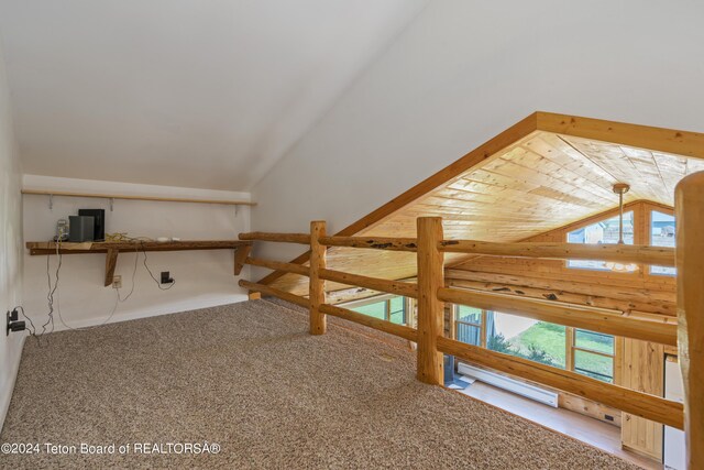 additional living space featuring carpet flooring, vaulted ceiling, and wood ceiling