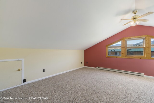 bonus room featuring a baseboard radiator, carpet flooring, and lofted ceiling