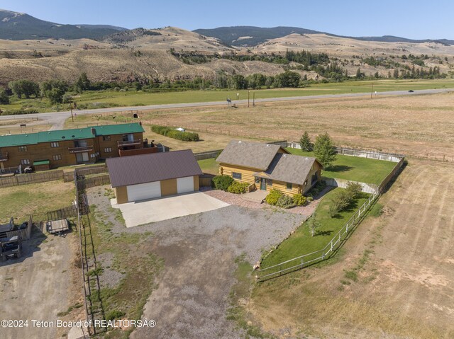 aerial view with a mountain view and a rural view