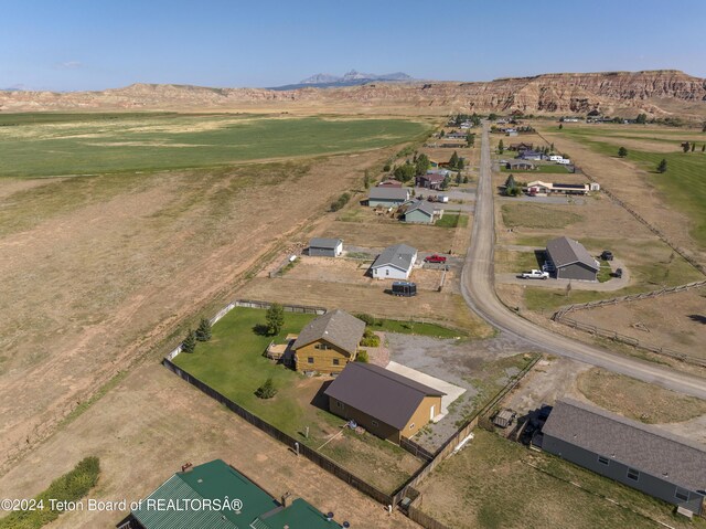 birds eye view of property with a rural view and a mountain view