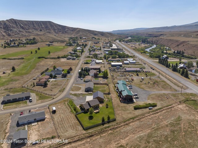 birds eye view of property featuring a mountain view