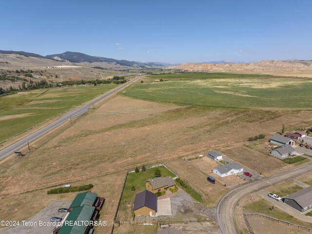 bird's eye view featuring a rural view and a mountain view