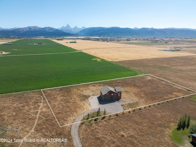 drone / aerial view featuring a rural view and a mountain view