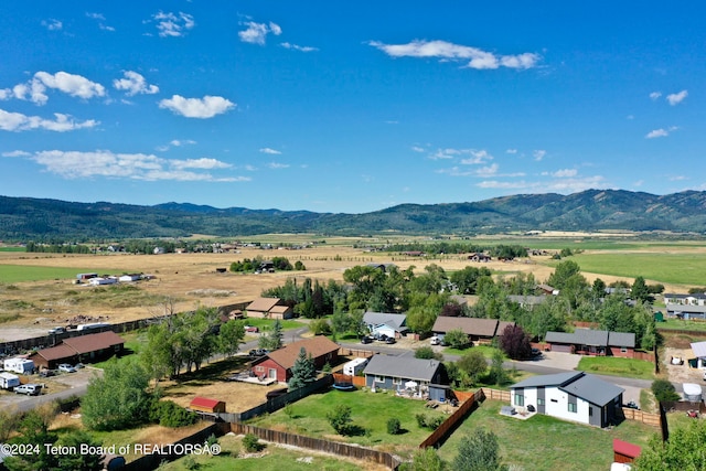 birds eye view of property featuring a mountain view