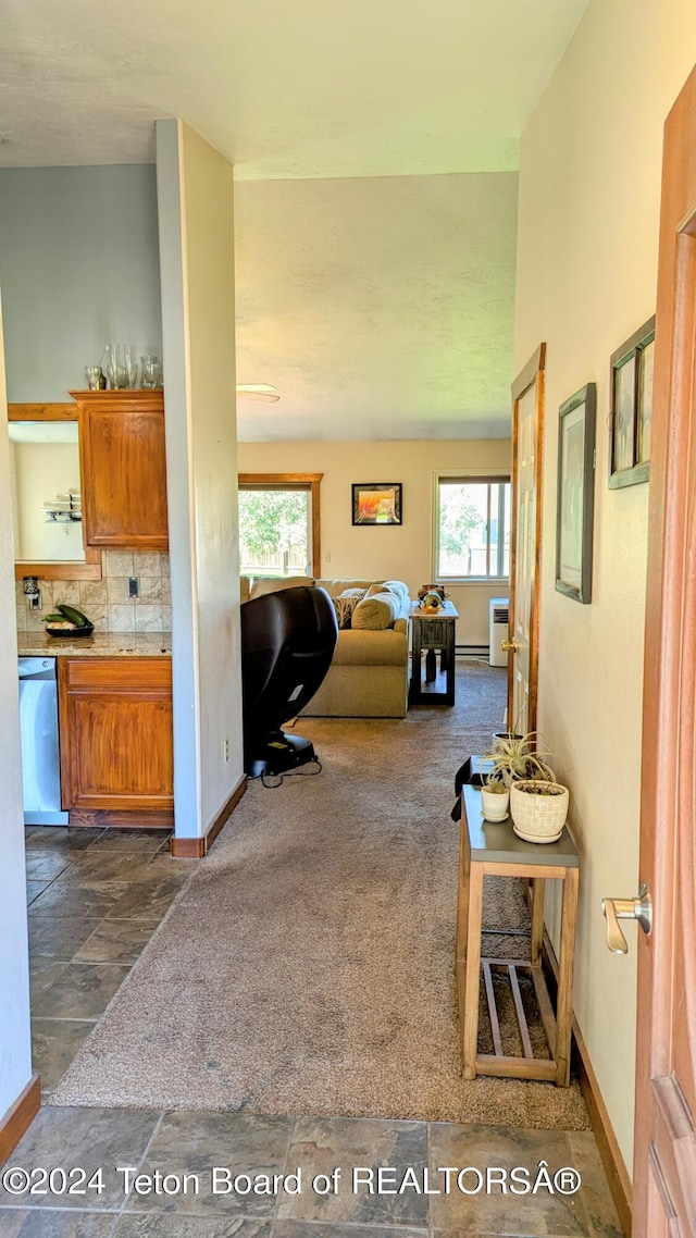 tiled living room with a healthy amount of sunlight