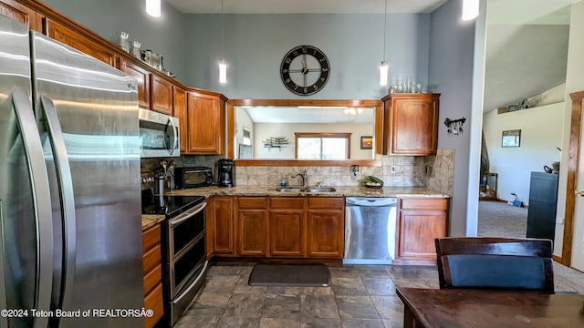 kitchen with appliances with stainless steel finishes, high vaulted ceiling, decorative backsplash, and light stone counters