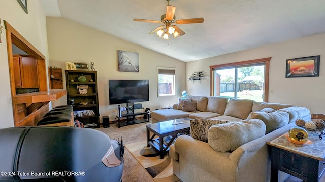 living room featuring ceiling fan, light carpet, and lofted ceiling