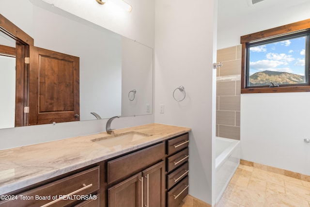 bathroom featuring shower / bathing tub combination and vanity