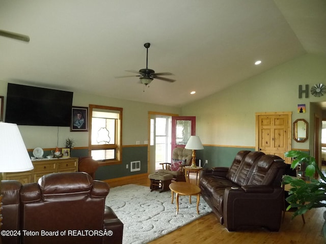 living room with visible vents, lofted ceiling, ceiling fan, wood finished floors, and recessed lighting