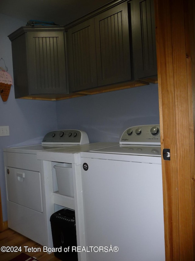 laundry room featuring cabinet space and separate washer and dryer