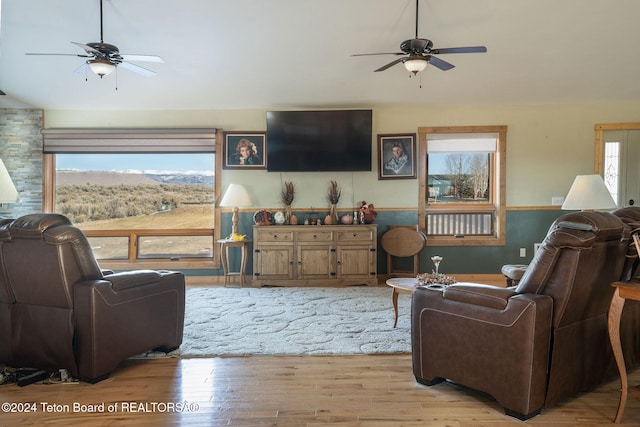 living area featuring ceiling fan and light wood-style flooring