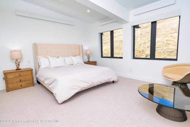 carpeted bedroom featuring baseboards, lofted ceiling, and recessed lighting
