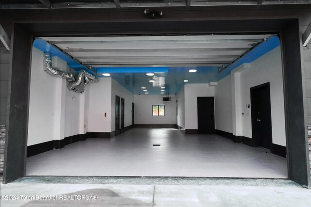 garage featuring baseboards