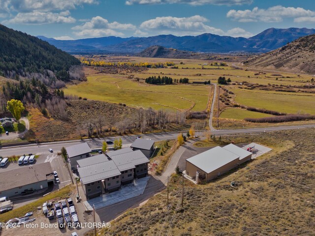 aerial view featuring a mountain view and a rural view