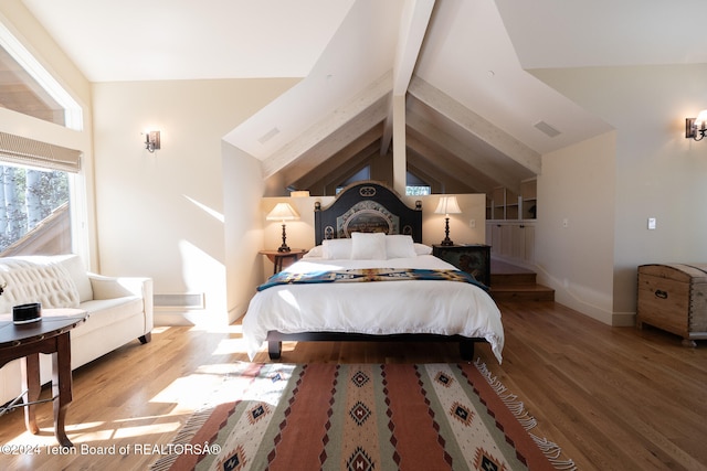 bedroom featuring hardwood / wood-style flooring and lofted ceiling with beams