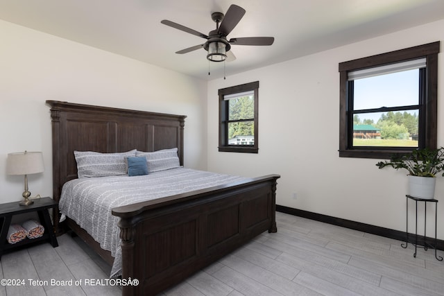 bedroom featuring ceiling fan and light hardwood / wood-style floors