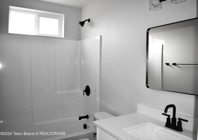 full bathroom featuring vanity, toilet, and shower / tub combination