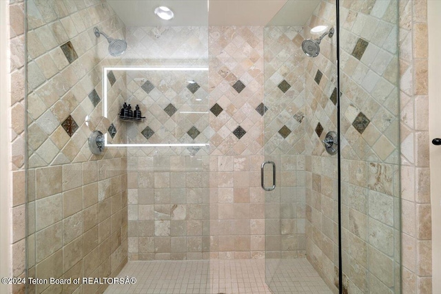 bathroom featuring an enclosed shower