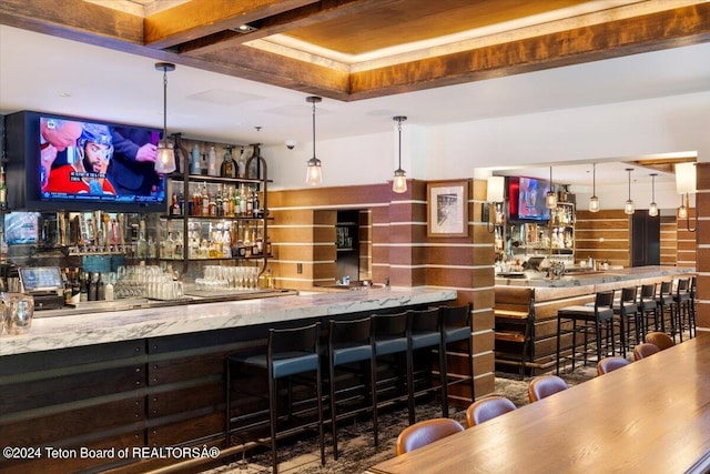 bar featuring hanging light fixtures