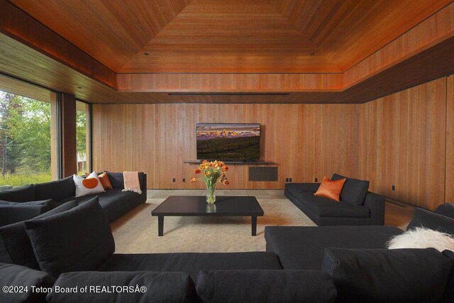 living room with wooden ceiling and wood walls