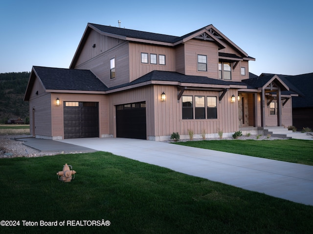 view of front of house with a front lawn and a garage