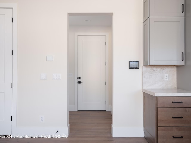 corridor featuring light hardwood / wood-style floors