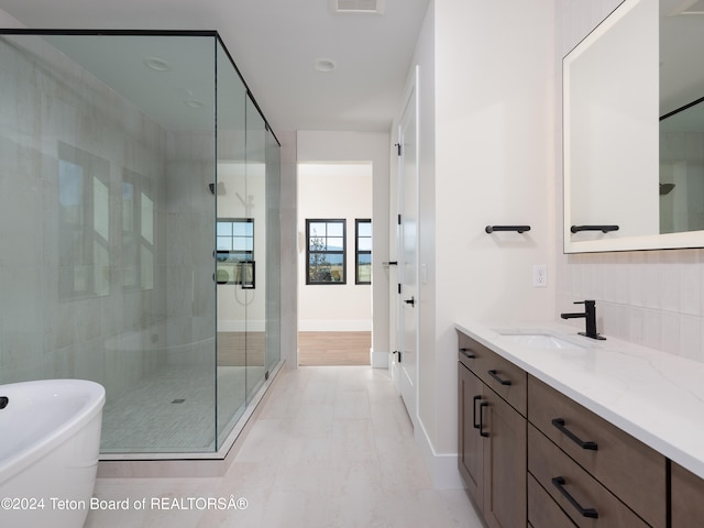 bathroom with vanity and plus walk in shower