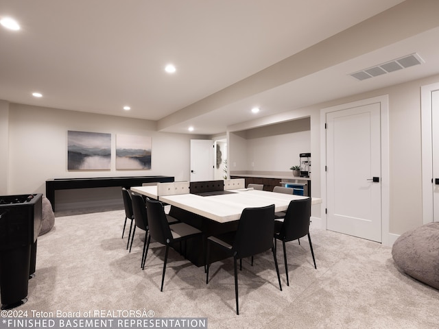 view of carpeted dining space