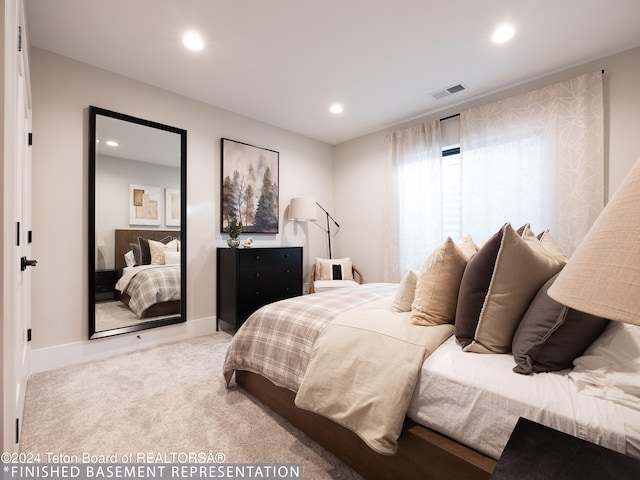 bedroom with light colored carpet