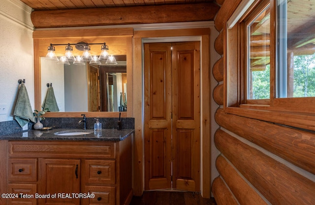 bathroom featuring wood ceiling, beam ceiling, hardwood / wood-style flooring, and vanity