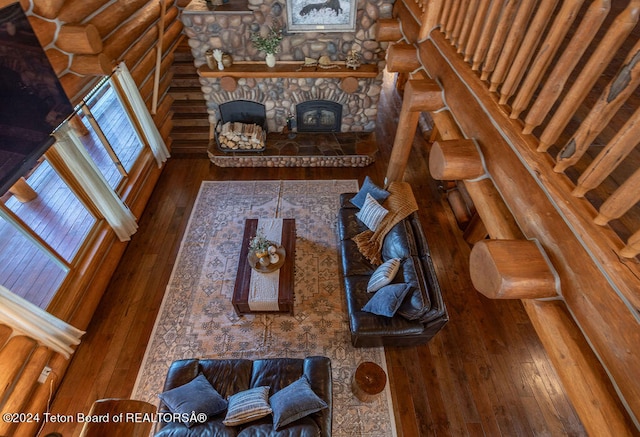 living room with hardwood / wood-style flooring and a fireplace