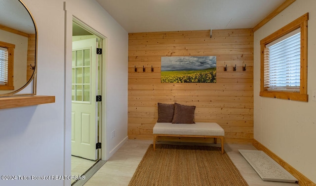 mudroom with wood walls