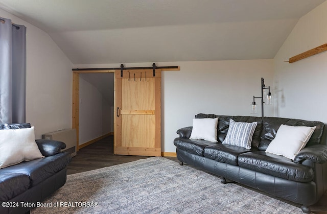 living room featuring lofted ceiling, radiator heating unit, dark wood-type flooring, and a barn door