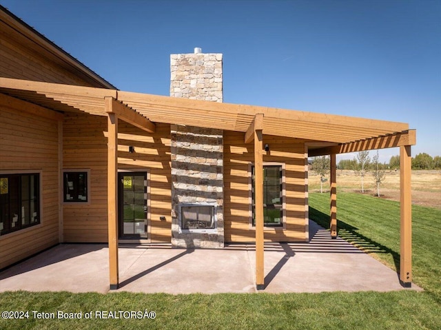 exterior space featuring a lawn, a pergola, and a patio