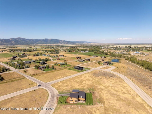 bird's eye view with a mountain view and a rural view