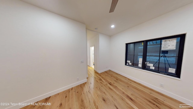 unfurnished room with hardwood / wood-style flooring