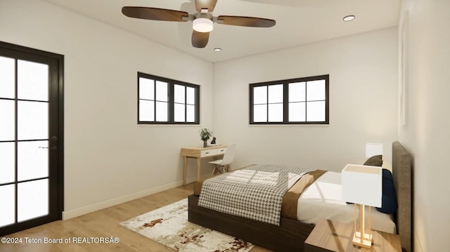 bedroom with light hardwood / wood-style flooring and ceiling fan