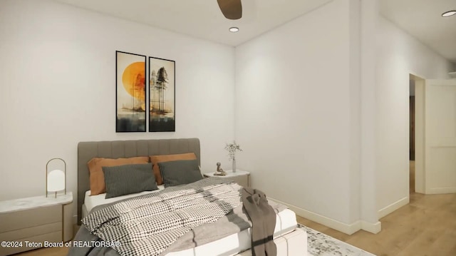 bedroom featuring ceiling fan and light hardwood / wood-style flooring