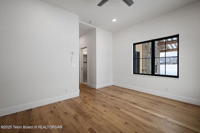 spare room with ceiling fan and light hardwood / wood-style flooring