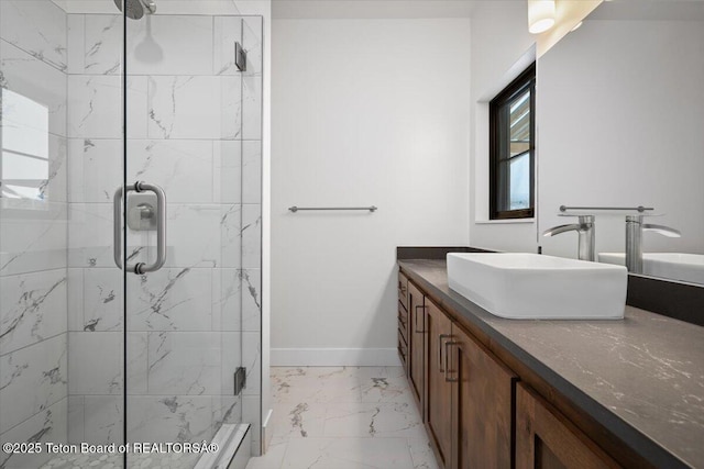 bathroom featuring vanity and a shower with door