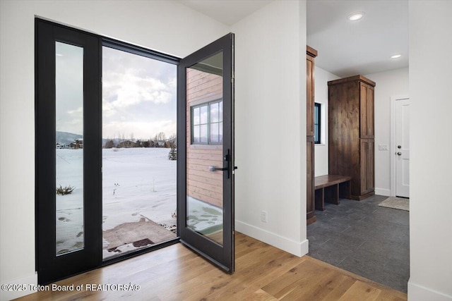 doorway to outside featuring wood-type flooring