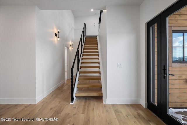 stairway featuring hardwood / wood-style flooring