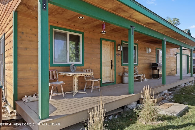 wooden deck with grilling area