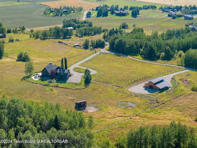 birds eye view of property featuring a rural view