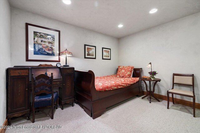 bedroom with recessed lighting, light colored carpet, and baseboards